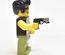 Пистолет Glock с лазерным целеуказателем. черно-зеленый камуфляж